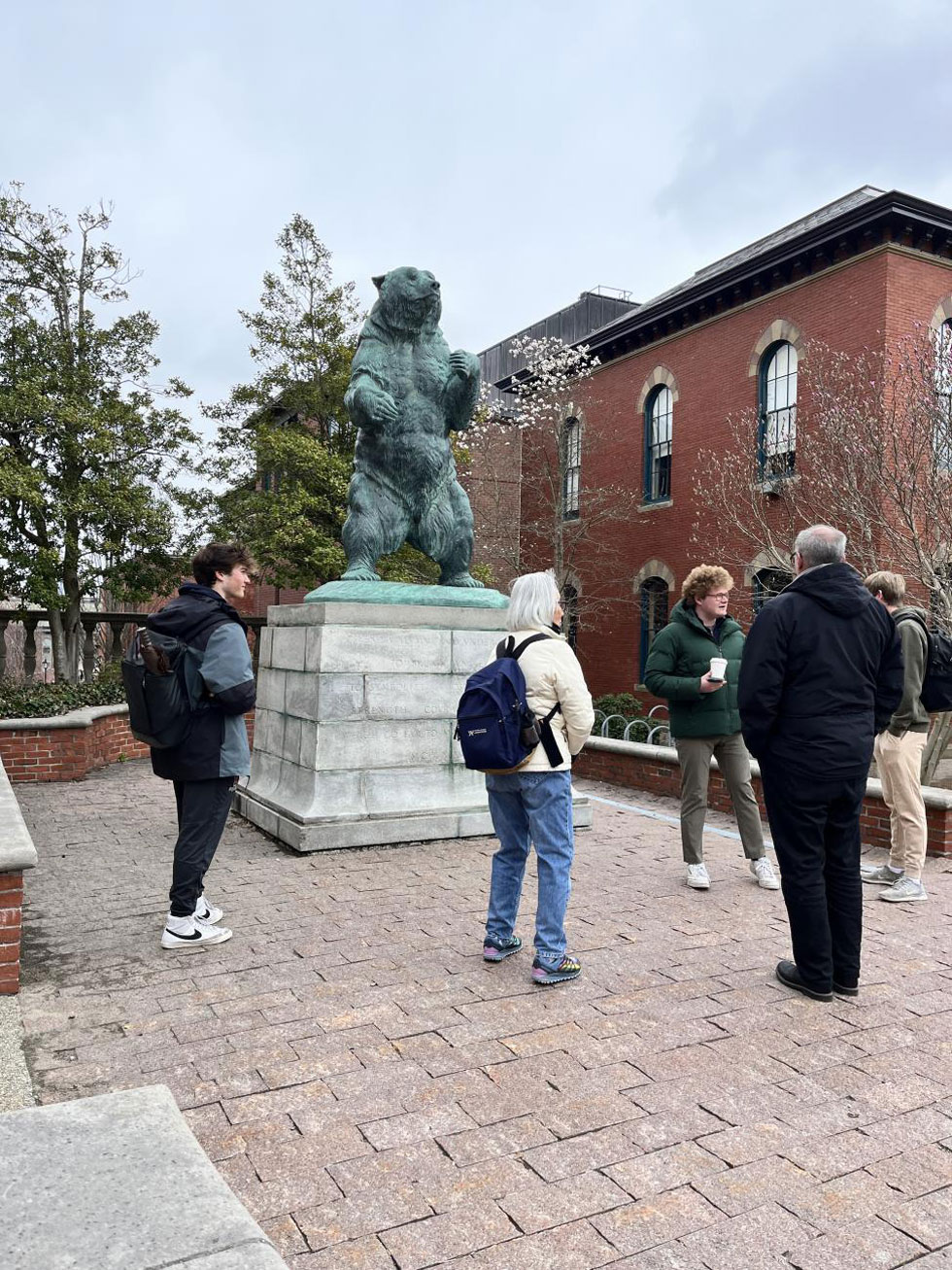 tour group near an outdoor bear statue